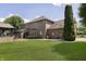 Beautifully landscaped backyard with patio, lush lawn, and mature trees offers a private outdoor retreat at 7430 Franklin Parke Woods, Indianapolis, IN 46259