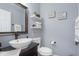 Stylish half bathroom with modern sink and faucet, complimented by tasteful decor and wall accents at 7430 Franklin Parke Woods, Indianapolis, IN 46259