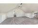Generous bonus room offers lots of space, natural light, neutral carpet, and convenient built-in storage solutions at 7430 Franklin Parke Woods, Indianapolis, IN 46259
