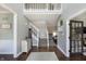 Inviting foyer featuring hardwood floors and a staircase to the second level at 7430 Franklin Parke Woods, Indianapolis, IN 46259