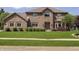 Charming brick home featuring manicured lawn and mature landscaping at 7430 Franklin Parke Woods, Indianapolis, IN 46259