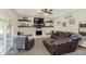 Cozy living room featuring brick fireplace and comfortable seating at 7430 Franklin Parke Woods, Indianapolis, IN 46259
