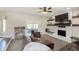 Relaxing living room with brick fireplace and sliding door to the patio at 7430 Franklin Parke Woods, Indianapolis, IN 46259