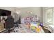 Bright playroom with lots of toys, natural light, and hardwood flooring at 7430 Franklin Parke Woods, Indianapolis, IN 46259