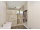 Attractive walk-in shower with tile surround, bench, and multiple shower heads at 7430 Franklin Parke Woods, Indianapolis, IN 46259