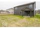 Backyard with minimal landscaping and two-story home with siding at 7517 Big Bend Blvd, Camby, IN 46113