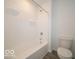 Clean bathroom features a white shower/tub combo and standard toilet at 7517 Big Bend Blvd, Camby, IN 46113