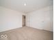 Neutral bedroom with a simple design, neutral carpet, and a closet at 7517 Big Bend Blvd, Camby, IN 46113