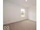 Clean bedroom with neutral carpet and a window providing natural light at 7517 Big Bend Blvd, Camby, IN 46113