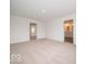 This carpeted bedroom features two doors leading to other rooms and neutral walls at 7517 Big Bend Blvd, Camby, IN 46113