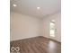 Open dining area with a glass door to the backyard, perfect for entertaining at 7517 Big Bend Blvd, Camby, IN 46113