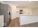 Bright kitchen showcasing stainless steel appliances, white cabinets, and a spacious island at 7517 Big Bend Blvd, Camby, IN 46113