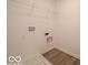 Laundry room with overhead shelf and modern hookups for a washer and dryer at 7517 Big Bend Blvd, Camby, IN 46113