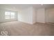 This expansive living room boasts neutral carpeting and plenty of space for entertaining at 7517 Big Bend Blvd, Camby, IN 46113