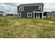 Exterior view of a two story house, gray siding, white trim, and green lawn at 7605 Big Bend Blvd, Camby, IN 46113