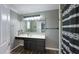 Well-lit bathroom with a dark vanity, modern mirror, and a stylish shower curtain at 80 E College Ave, Martinsville, IN 46151
