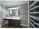 This bathroom features a large mirror, soft lighting, and hardwood floors at 80 E College Ave, Martinsville, IN 46151