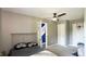 This bedroom features a ceiling fan, a sporty basketball hoop, and plenty of natural light at 80 E College Ave, Martinsville, IN 46151