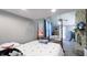Cozy bedroom with a four-poster bed, fireplace, and comfortable seating area at 80 E College Ave, Martinsville, IN 46151