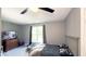This bedroom is a calm and cozy retreat with a dresser and plenty of space to relax at 80 E College Ave, Martinsville, IN 46151