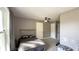 Cozy bedroom featuring plush carpeting and a ceiling fan for added comfort at 80 E College Ave, Martinsville, IN 46151