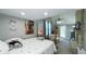 This bedroom features a large bed, a stone fireplace, and shark decorations at 80 E College Ave, Martinsville, IN 46151
