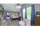 Bright, well-lit primary bedroom featuring a fireplace, four-poster bed, and lots of natural light at 80 E College Ave, Martinsville, IN 46151