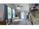 This bedroom features a sitting area, a stone fireplace, shark decorations and lots of natural light at 80 E College Ave, Martinsville, IN 46151