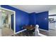 This dining area features blue walls and hardwood floors and is conveniently located off the kitchen at 80 E College Ave, Martinsville, IN 46151