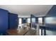 A cozy dining room shows wood floors and a view into the open living area and staircase at 80 E College Ave, Martinsville, IN 46151