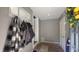 Bright entryway with brick floors and coat rack, leading to other rooms in the house at 80 E College Ave, Martinsville, IN 46151