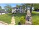 Charming two-story brick home with landscaped yard and inviting front entrance at 80 E College Ave, Martinsville, IN 46151