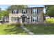 Charming two-story brick home with black shutters and a welcoming front entrance at 80 E College Ave, Martinsville, IN 46151