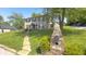Brick home on a hill with a landscaped yard, mailbox, and a charming walkway at 80 E College Ave, Martinsville, IN 46151