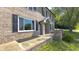 Attractive brick home with covered front porch and well-maintained landscaping at 80 E College Ave, Martinsville, IN 46151