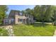 Beautiful brick home with manicured lawn and mature trees, offering great curb appeal at 80 E College Ave, Martinsville, IN 46151