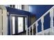 Bright Foyer with decorative glass door, hardwood floors, and staircase to second level at 80 E College Ave, Martinsville, IN 46151