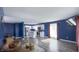 Open concept living space shows the kitchen and dining areas, wood flooring, and abundant natural light at 80 E College Ave, Martinsville, IN 46151