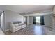 Living room features a barn door and large window with curtains for natural light and privacy at 80 E College Ave, Martinsville, IN 46151