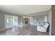 Inviting living room features a cozy brick fireplace, creating a warm focal point in the space at 80 E College Ave, Martinsville, IN 46151