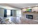 Spacious living room featuring a brick fireplace and hardwood floors at 80 E College Ave, Martinsville, IN 46151