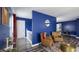 Cozy living room shows wood floors, seating area, and access to the staircase and second floor at 80 E College Ave, Martinsville, IN 46151