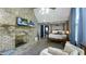 Bright main bedroom features a brick fireplace, sitting area, and ensuite bathroom at 80 E College Ave, Martinsville, IN 46151