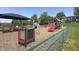 Community playground with playset, picnic tables, and basketball hoop ready for fun at 80 E College Ave, Martinsville, IN 46151