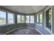 Sunroom with multiple windows that offers a view of the neighborhood and brings in ample natural light at 80 E College Ave, Martinsville, IN 46151