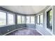 Bright sunroom with brick flooring and multiple windows offering ample natural light at 80 E College Ave, Martinsville, IN 46151