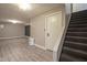 Finished basement with vinyl flooring, recessed lighting, and a stairway at 858 Cedar Wood, Carmel, IN 46032