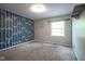 Bedroom with blue geometric accent wall, carpet, one window and neutral paint at 858 Cedar Wood, Carmel, IN 46032
