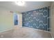 Bedroom with blue geometric accent wall, carpet, open closet, and neutral paint at 858 Cedar Wood, Carmel, IN 46032