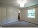 Bedroom with a view of the backyard, and open closet with shelf space at 858 Cedar Wood, Carmel, IN 46032